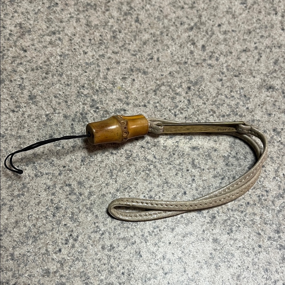 Gucci bamboo cellphone accessory charm vintage with tan strap great conditions